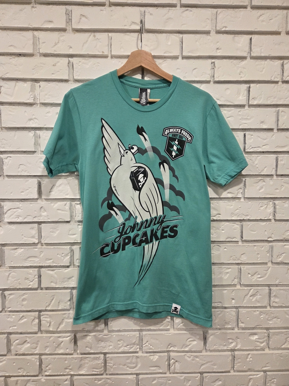 Johnny Cupcakes Teal Graphic Short Sleeve Carrier Pidgeon